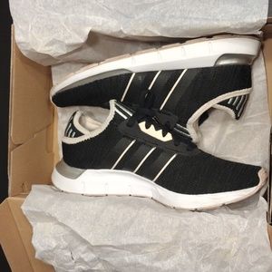 Woman's adidas  black and light pink athletic shoes.